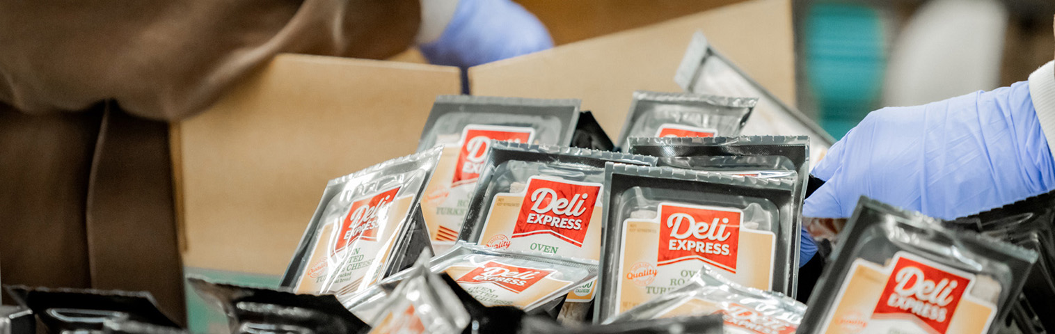 Deli Express sandwiches in a box being prepared for shipment